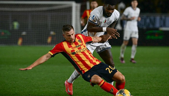 Inter Milans French forward #09 Marcus Thuram (R) fights for the ball with Lecces German Albanian midfielder #20 Ylber Ramadani during the Italian Serie A football match between US Lecce and Inter Milan at the Via del Mare Stadium in Lecce on January 26, 2025. — AFP