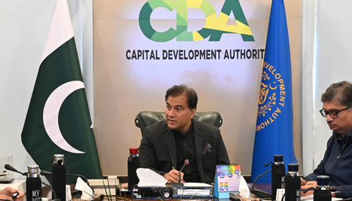 Chairman of the Capital Development Authority (CDA), Muhammad Ali Randhawa (left), looks left as he speaks in a meeting at the Capital Development Authority (CDA) office on January 24, 2025. — Facebook@/cda.isb.pk