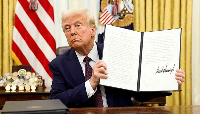 US President Donald Trump holds a signed executive order on AI, in the Oval Office of the White House, in Washington, US, January 23, 2025. — Reuters