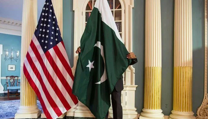 A US State Department personnel adjusts a Pakistan national flag in Washington, US. — Reuters/File