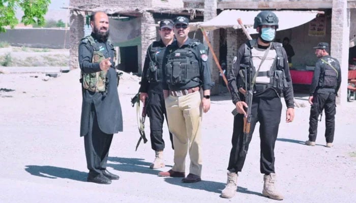 Representational image shows KP police personnel standing guard on the road on May 6, 2024. — Facebook@BannuPolice