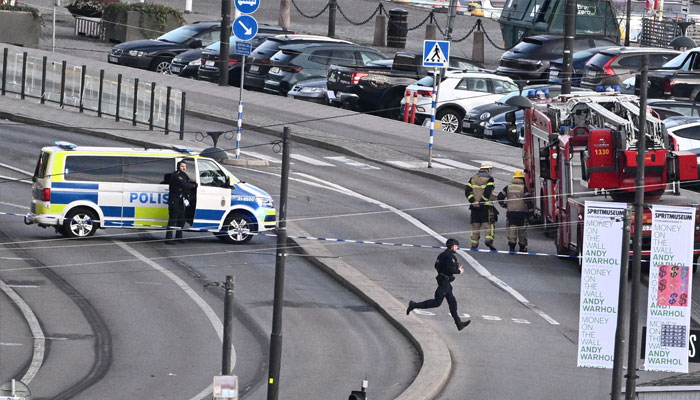 Police bomb squad on site in the Old Town of Stockholm, Sweden, October 30, 2024, after reports of a hand grenade on the Skeppsbron bridge. — Reuters