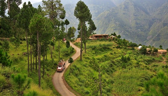 The representational image shows tourists moving through a scenic place in Azad Jammu and Kashmir. — APP/File