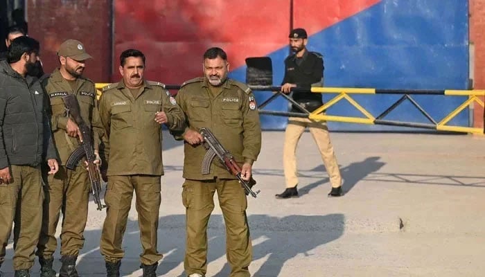 This image shows Punjab police personnel standing alert at an undisclosed location. — AFP/File