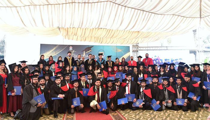 Punjab University Vice Chancellor Prof Dr M Ali in a group photo with graduates at the 14th graduation ceremony of the Punjab University’s Hailey College of Banking & Finance (HCBF) on January 31, 2025. — Facebook@UniversityOfThePunjab.Official