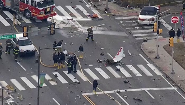 Firefighters and investigators examine debris a day after the deadly crash of a medevac plane operated by Mexico-based Jet Rescue Air Ambulance in Philadelphia, Pennsylvania, U.S. February 1, 2025 in a still image from video. — Reuters
