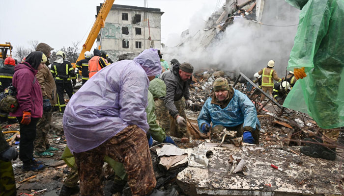 Rescuers combing the ruins of a smouldering building in Poltava, central Ukraine, for survivors. — AFP/File