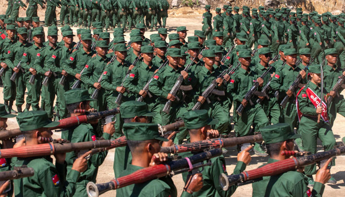 Members of the Mandalay Peoples Defense Forces rebel group marching in a graduation ceremony after training at a camp in an undisclosed location in Myanmars northern Shan State in December. — AFP/File
