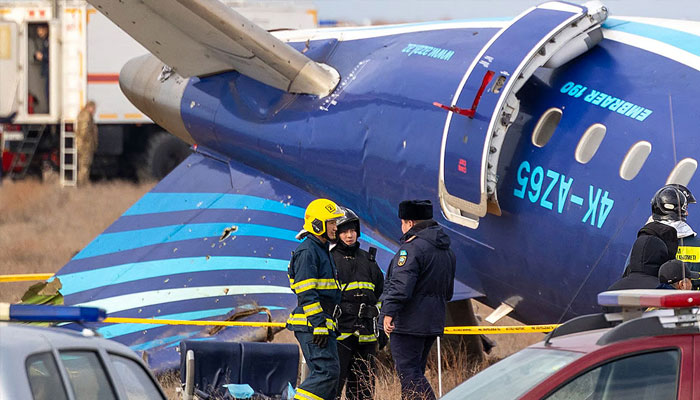 Emergency specialists work at the crash site of an Azerbaijan Airlines passenger jet near the western Kazakh city of Aktau on December 25, 2024. — AFP