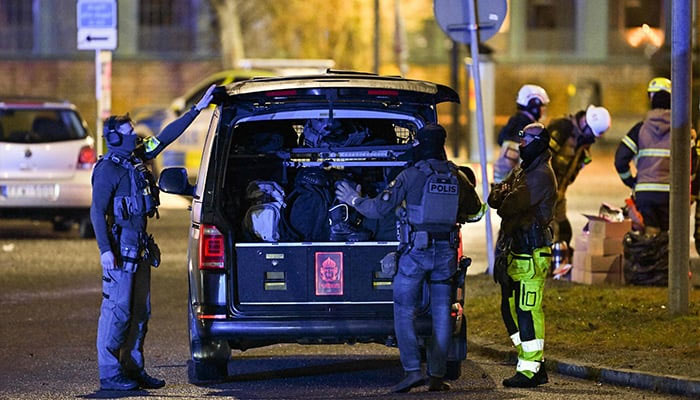 Members of the police special forces leave the scene at the Risbergska School in Orebro, Sweden, on February 4, 2025, following reports of a serious violent crime. — AFP