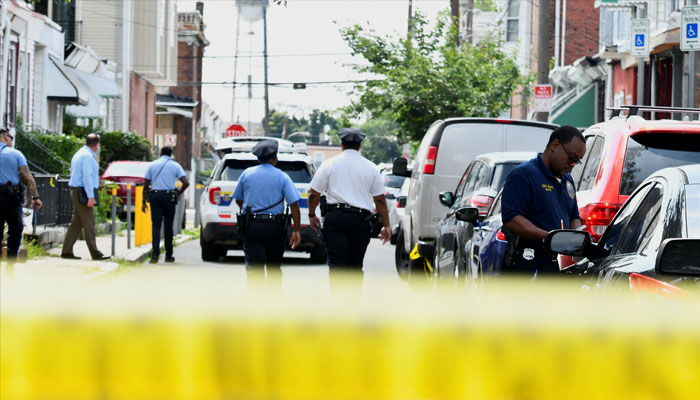 Police officers work at the scene as investigations are ongoing the day after a mass shooting in the Kingsessing section of southwest Philadelphia, Pennsylvania, US July 4, 2023. — Reuters