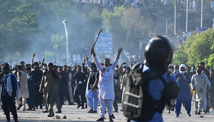 PTI supporters clash with police in Islamabad. — AFP/File