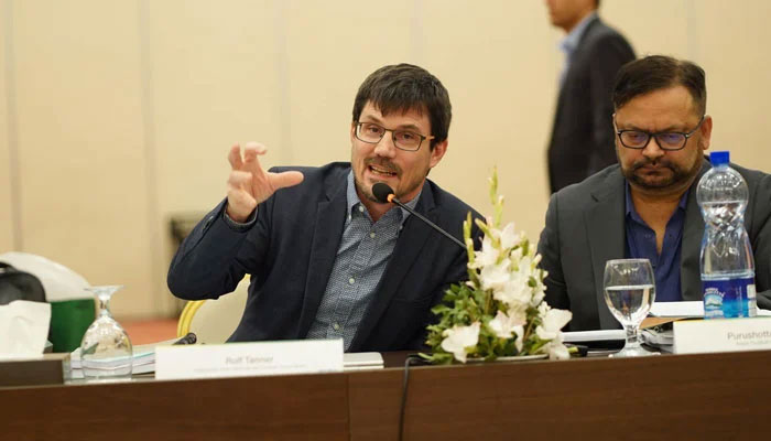 This undated picture shows FIFAs Head of MA Governance Rolf Tanner (left) speaking during a Pakistan Football Federations Extraordinary Congress meeting. — PFF