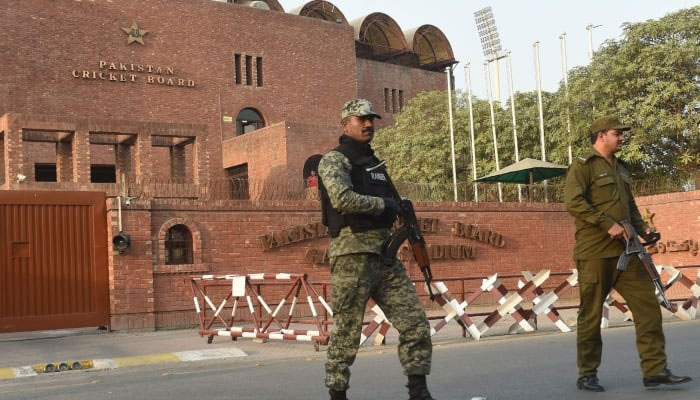 Pakistani soldiers stand outside the Gaddafi Stadium in Lahore, October 25, 2017. — AFP