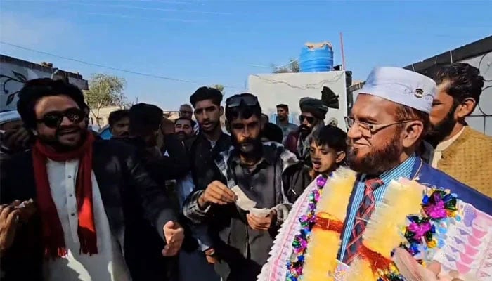 The screengrab taken on February 6, 2025, shows locals welcoming Iftikhar Hussain at his family village in Chakwal, Punjab. — ANI
