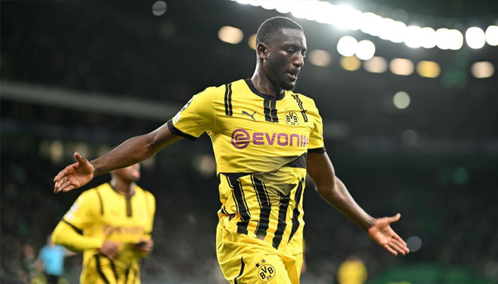 Borussia Dortmunds Guinean forward Sehrou Guirassy celebrates scoring his teams first goal at Sporting Lisbon. —AFP/File