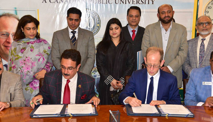 PU VC Prof Dr Muhammad Ali (left) and President and Vice-Chancellor University of Regina Dr Jeff Keshen (right) sign an MOU to promote exchange programmes, academic and research activities during a signing ceremony at  PU VC’s office on February 12, 2025. — Facebook@UniversityOfThePunjab.Official