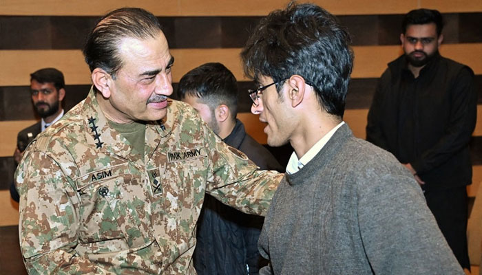 Chief of Army Staff (COAS) General Asim Munir shaking hand with a student, February 12, 2025. — ISPR