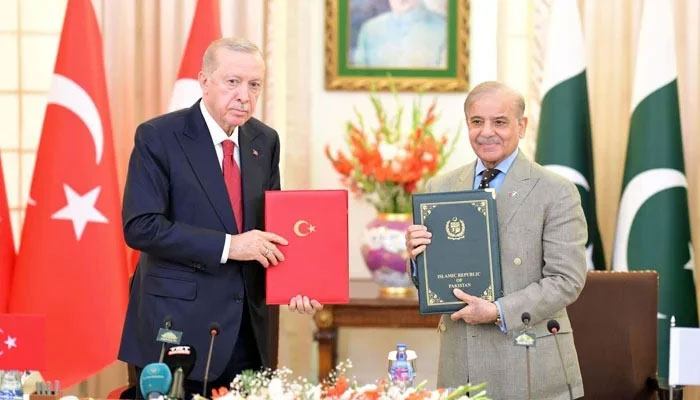 President of Turkiye Recep Tayyip Erdogan and Prime Minister of Pakistan Muhammad Shehbaz Sharif display joint declaration of 7th meeting of Turkiye-Pakistan High Level Strategic Cooperation Council in Federal Capital on February 13, 2025. — Online