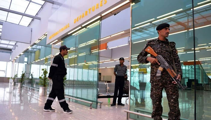 Security officials from the Airport Security Force (ASF) stand guard at the airport. — AFP/File