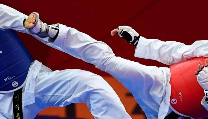 Representational image of taekwondo fighters in action. —AFP/File