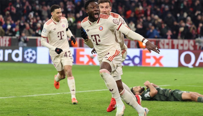 Alphonso Davies runs off in celebration after scoring the late goal which took Bayern Munich through to the Champions League last 16 at Celtics expense. —AFP/File