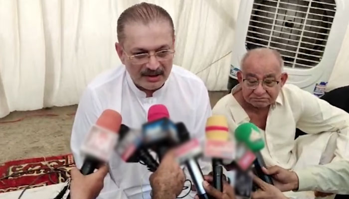 Sindh Senior Minister for Information and Transport Sharjeel Inaam Memon (left) talks to the media after reciting Fateha for Nawab Yusuf Talpur in Umerkot district on February 19, 2025. — Screengrab via Facebook@SharjeelInamMemon63