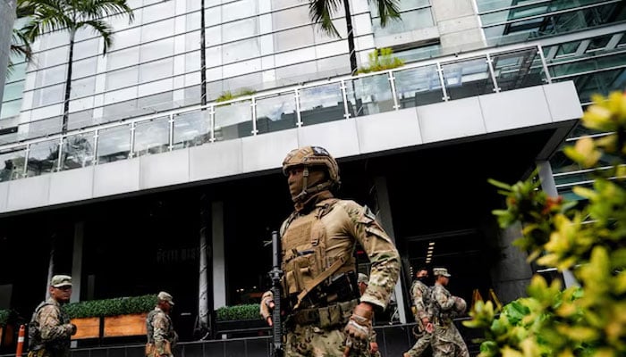 Members of Panamas National Aeronaval Service police (SENAN) stand outside the hotel where migrants from Asia and the Middle East are housed after being deported to Panama as part of an agreement between the administration of US President Donald Trump and the Central American nation, in Panama City, Panama February 18, 2025.— Reuters