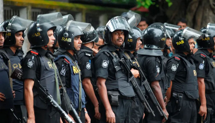 The Rapid Action Battalion personals standing alert. — Reuters/File