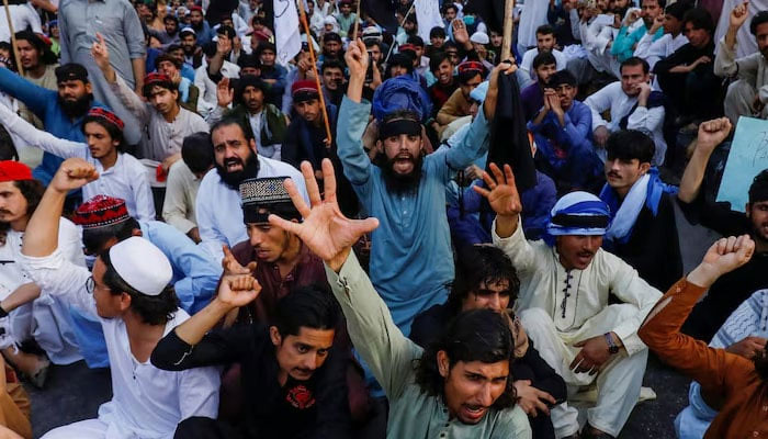 People chant slogans demanding an investigation following the deaths of four teenagers in Jani Khel area in  KPs Bannu district during a protest in Karachi. — Reuters/File