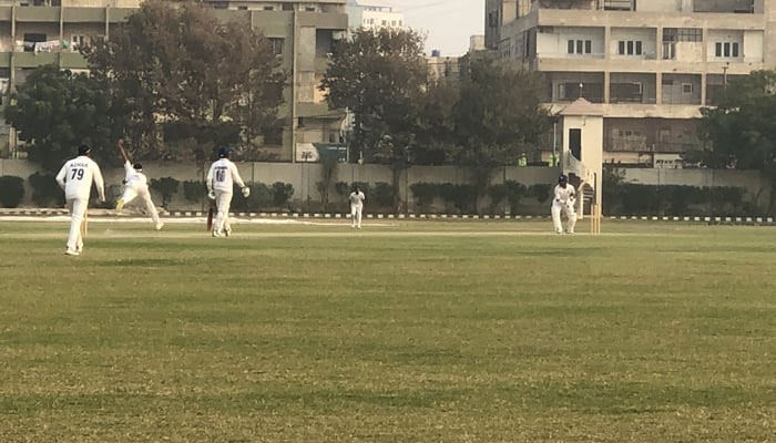 Cricket players can be seen during the Presidents Trophy match between Ghani Glass and State Bank of Pakistan at the UBL Stadium in Karachi. — X/@mak_asif