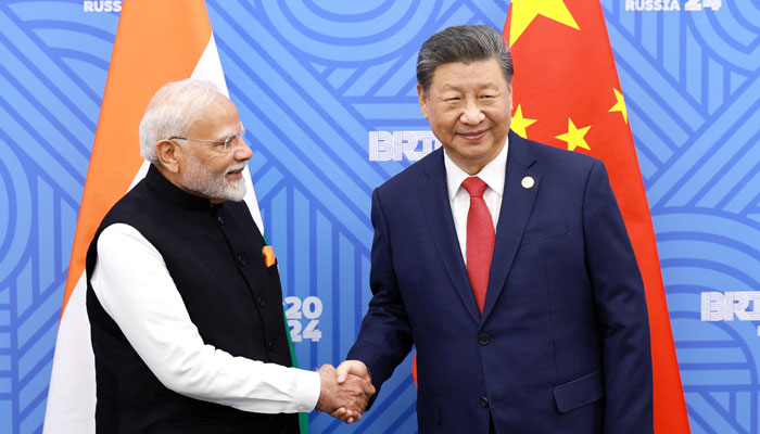 Chinese President Xi Jinping and India Prime Minister Narendra Modi meet on the sidelines of the BRICS summit in Kazan, Russia October 23, 2024. — Reuters