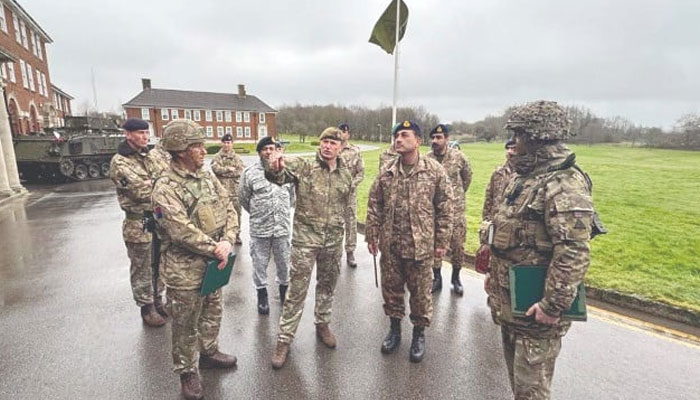 COAS Gen Syed Asim Munir is being briefed by British army officers during his visit to Warminster and Larkhill garrisons. — PPI
