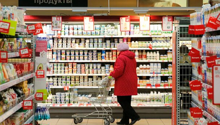 A customer shops at a Victoria supermarket operated by Russian food retailer Dixy Group in Moscow, Russia. — Reuters/File