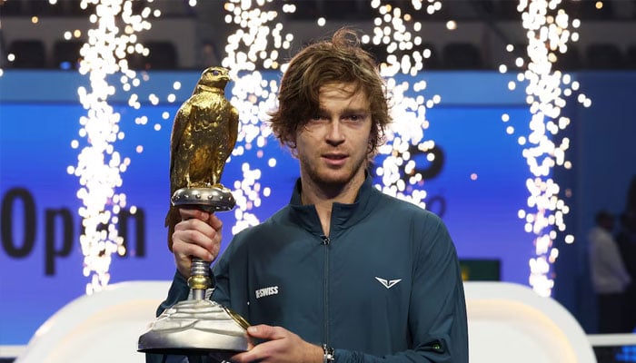 Russias Andrey Rublev celebrates with the trophy after winning the final against Britains Jack Draper, February 22, 2025. — Reuters