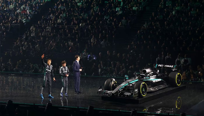 Mercedes team principal Toto Wolff with drivers George Russell and Andrea Kimi Antonelli during their car reveal at the launch, February 18, 2025. — Reuters