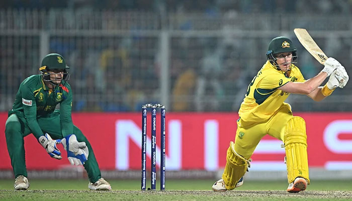Australias Marnus Labuschagne (R) plays a shot as South Africas wicketkeeper Quinton de Kock watches during the 2023 ICC Mens Cricket World Cup one-day international (ODI) second semi-final match between Australia and South Africa at the Eden Gardens in Kolkata on November 16, 2023. — AFP
