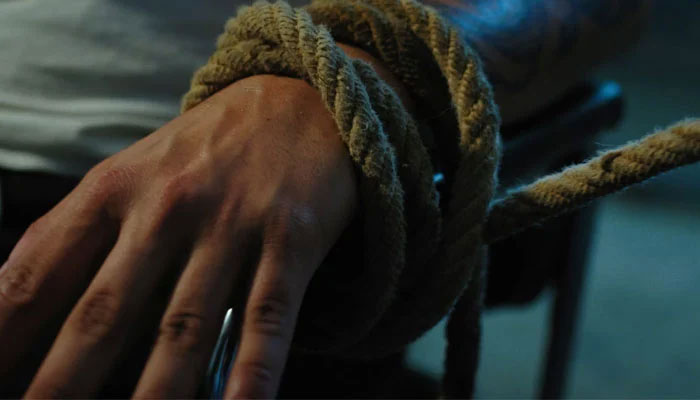 Representational image of a man with tied hands. — Unsplash/File