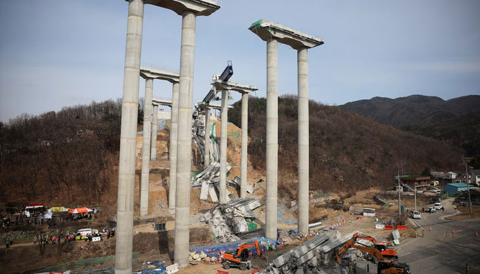 Rescue workers participate in a salvage operation at a collapsed highway construction site in Cheonan, South Korea, February 25, 2025. — Reuters