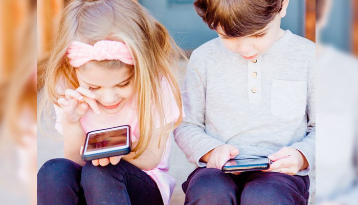 Children using smart phones. —Unsplash/File