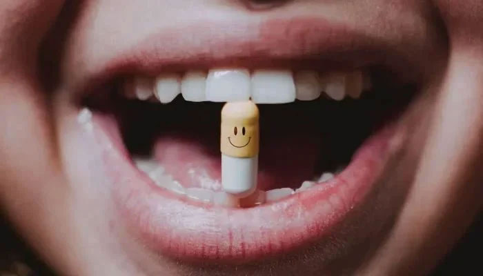 Representational image shows a person with a pill between teeth.— Pexels/File