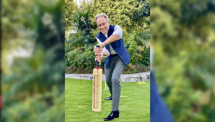Australia’s High Commissioner to Pakistan, Neil Hawkins poses for a photo, holding bat. — Facebook@AustraliainPakistan/File