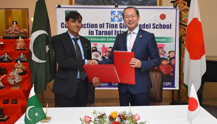Ambassador of Japan to the Islamic Republic of Pakistan Akamatsu Shuichi (right) and a representative of the NGO shake hands after signing a grant contract at the Embassy of Japan in Islamabad on February 27, 2025. — INP