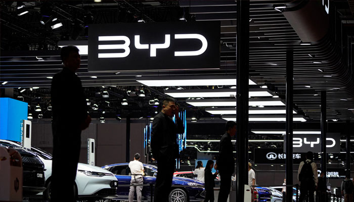 Security guards stand at the BYD booth at the Auto Shanghai show, in Shanghai, China April 19, 2023. — Reuters