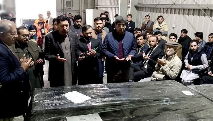 People offer fateha after receiving the bodies of six Pakistanis killed in the Libya boat mishap at Islamabad Airport on February 27, 2025. — INP
