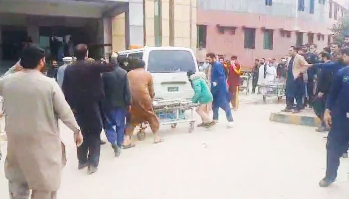People gathered outside a medical facility after a blast ripped through Darul Uloom Haqqania, Akora Khattak, Nowshera, on February 28, 2025. — Geo News