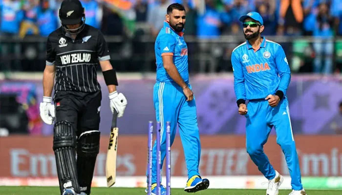 Virat Kolhi and Muhammad Shami celebrating after taking wicket of New Zealand player. — AFP/File