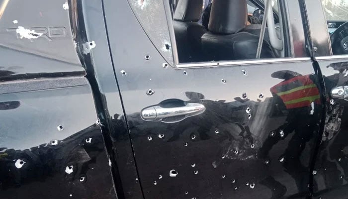 Bullet marks can be seen on the car after firing by unidentified assailants in Gujrat, Punjab, on March 2, 2025. — Reporter/Riaz Ahmed Rasikh
