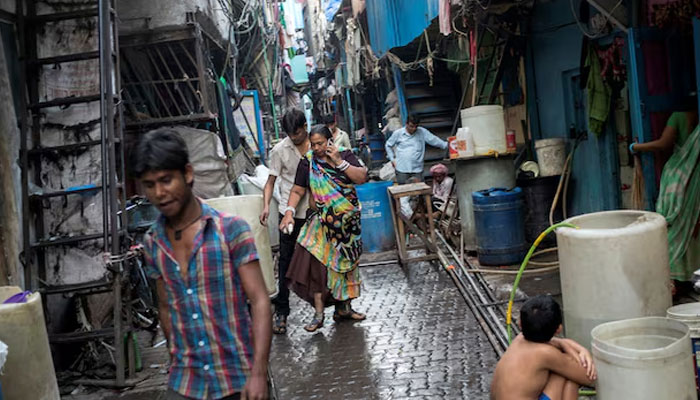 Residents walk in an alley in Dharavi, one of Asias largest slums, in Mumbai March 12, 2015.—Reuters