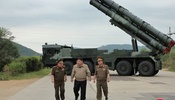 North Korean leader Kim Jong Un oversees a test-fire for a new 600mm multiple rocket launcher at an undisclosed location in North Korea, in this photo released on September 13, 2024.    —Reuters